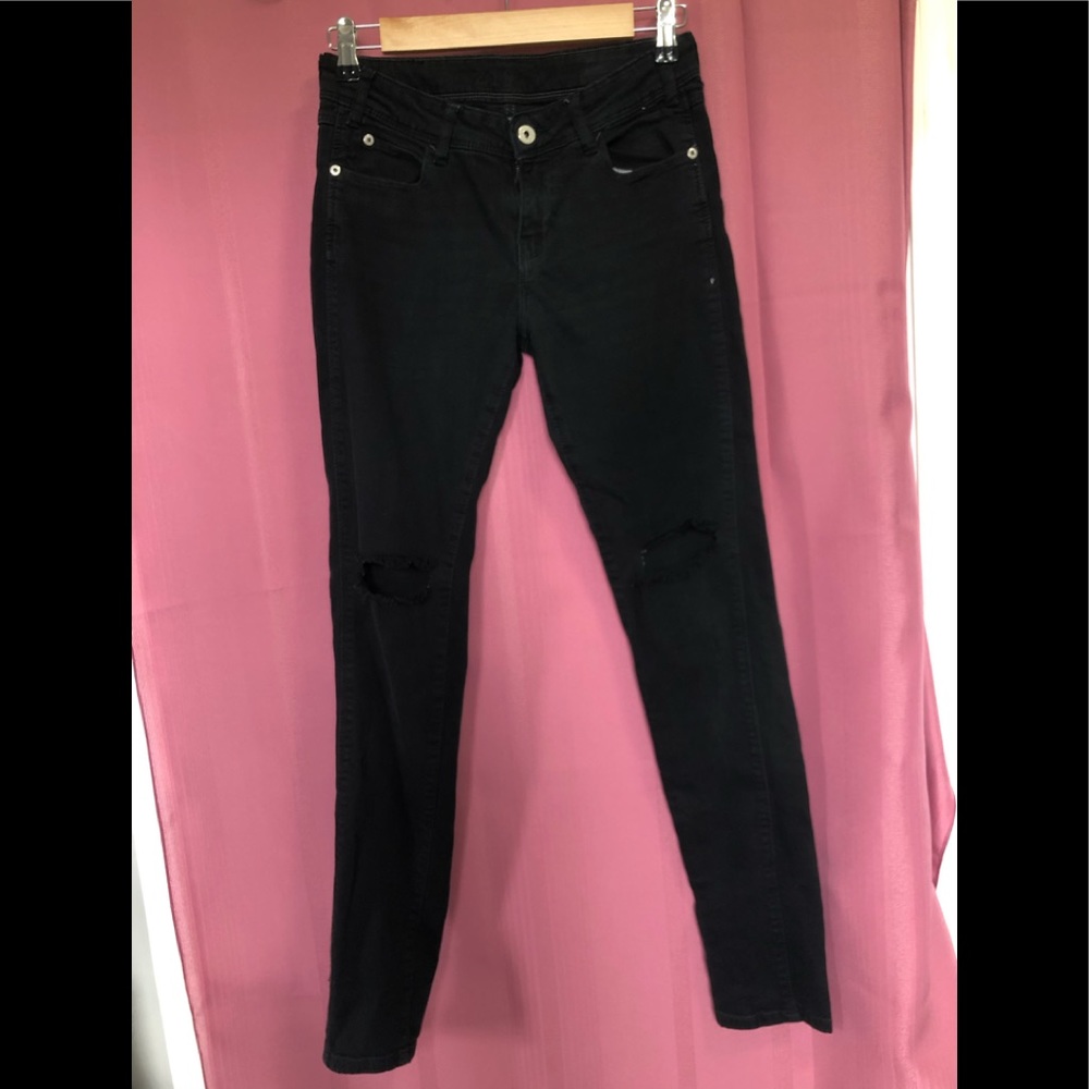 High waisted black jeans with knee slits